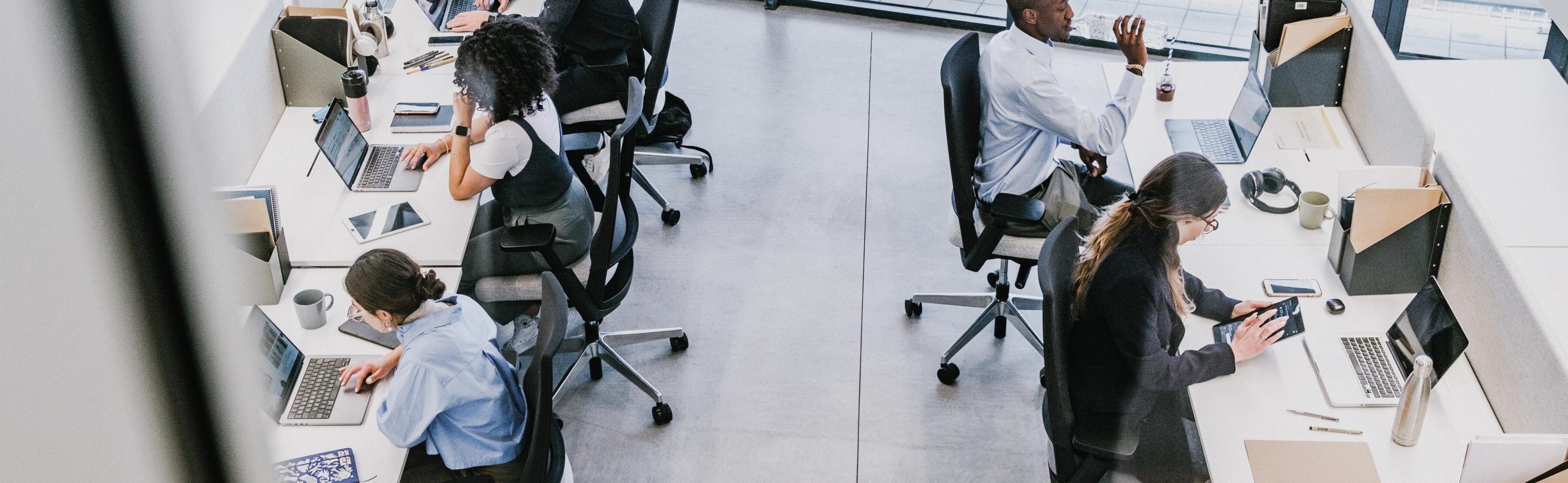 View of corporate employees working in a modern office